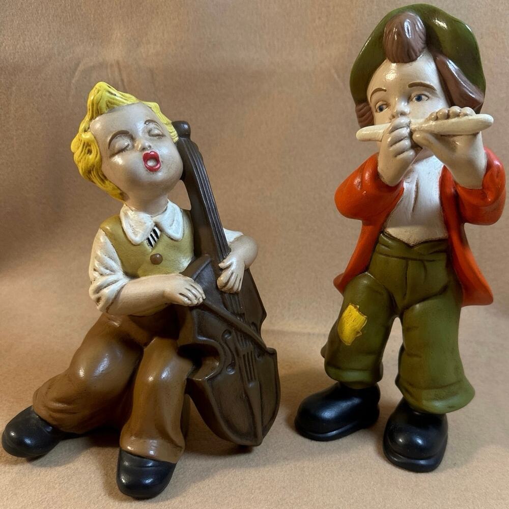Vintage mid-century ceramic figurines singing boy w/cello & boy w/flute. 1973